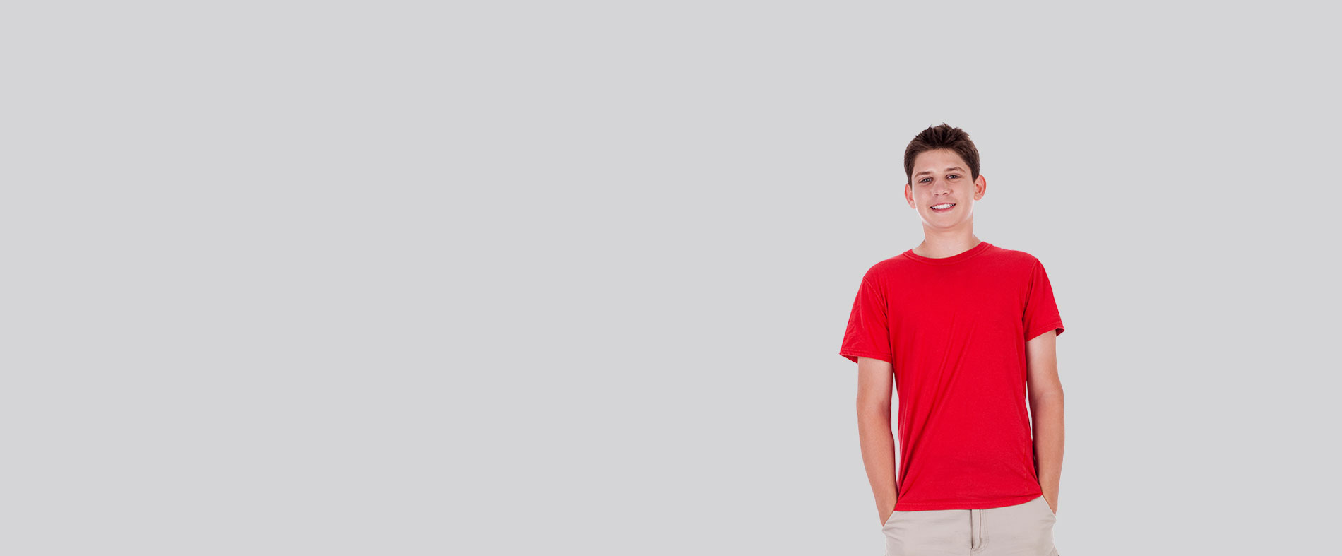 The image features a person standing against a plain background, wearing a red shirt and khaki pants, with a neutral expression on their face.